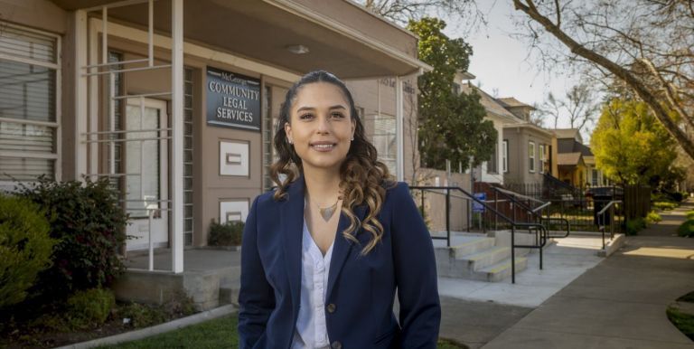 McGeorge 3L and Immigration Law Clinic student Erika Patty Muñoz outside the McGeorge Community Legal Services building