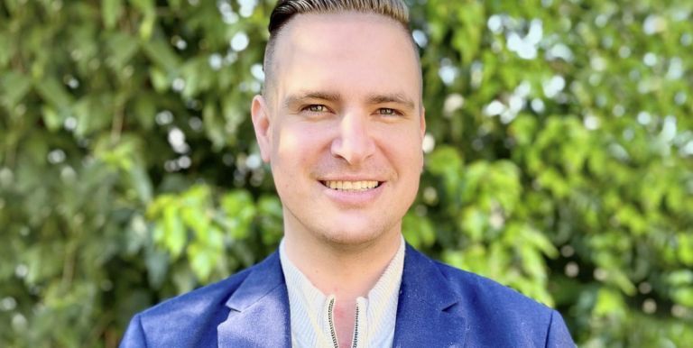 A man in a blue blazer
