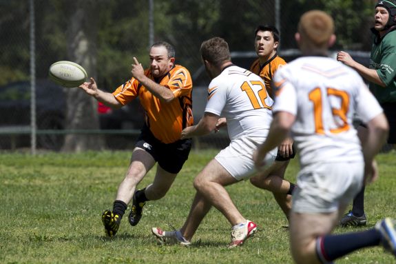 Two rugby teams are engaged in active play.