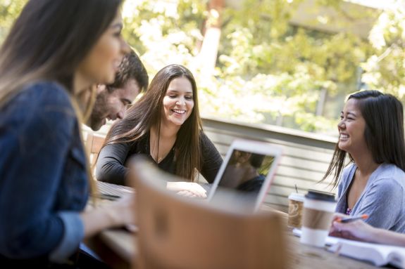 A group of women sit at a table.