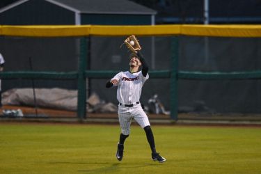 Pacific baseball player catches the ball.