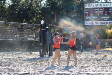 Beach volleyball celebrates point scored