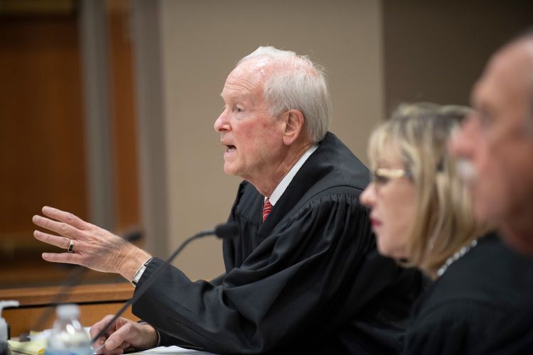 A judge makes a hand gesture