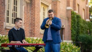 Jazz Studies student and professors playing outside