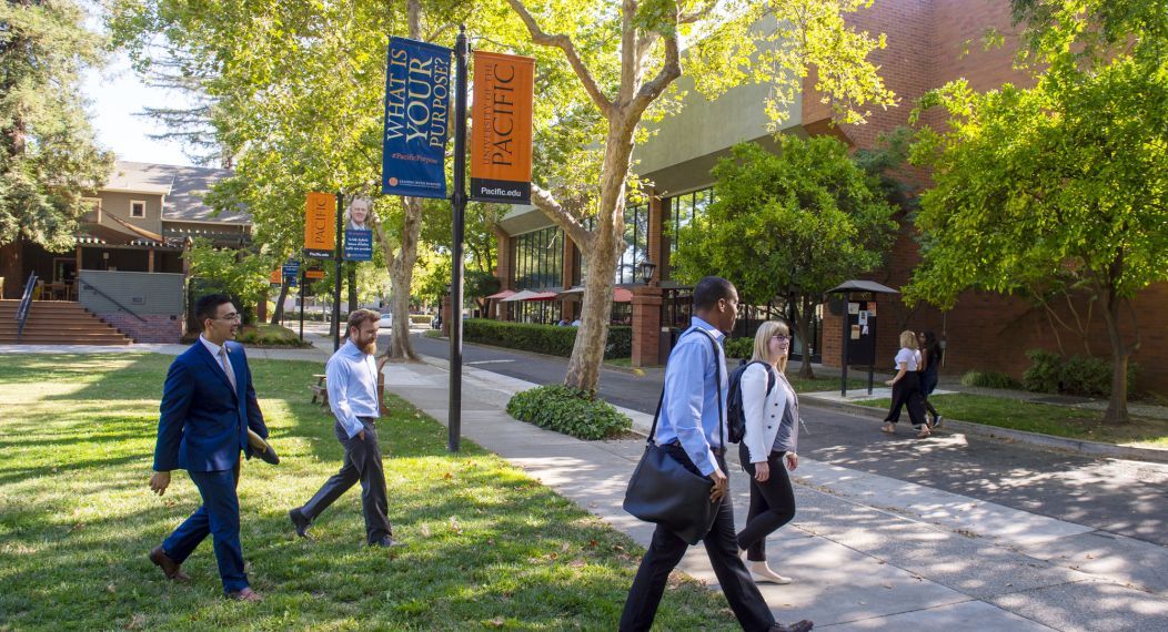 students walk on the Sacramento campus