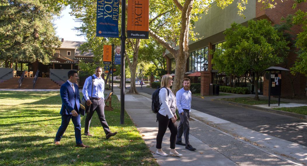 students crossing the street next to the sacramento campus quad
