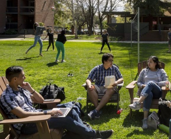 students relaxing the the sacramento campus quad