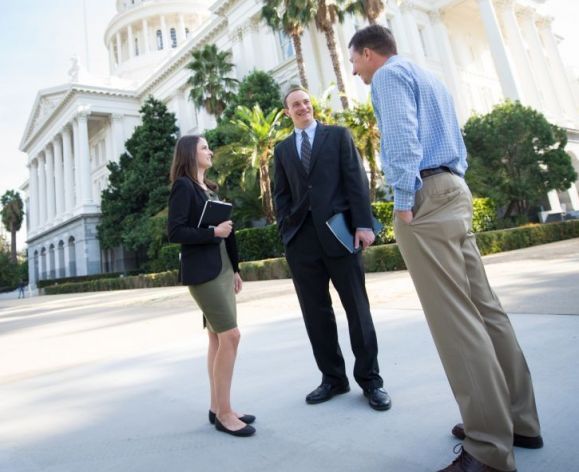 three mcgeorge students at the capitol